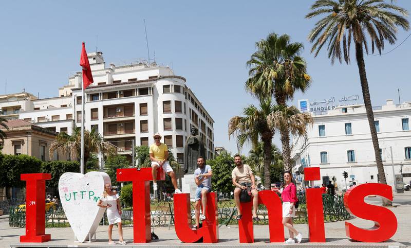 Tourists poses for picture in downtown Tunis, Tunisia, August 4, 2017.  REUTERS/Zoubeir Souissi