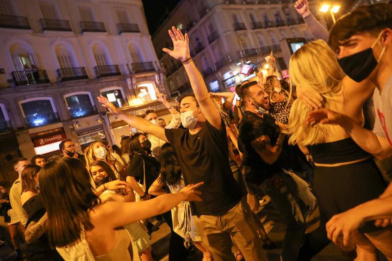 Crowds cheered the clock in Madrid's Puerta del Sol square striking midnight to signal the end of the curfew in scenes reminiscent of New Year's Eve. Reuters