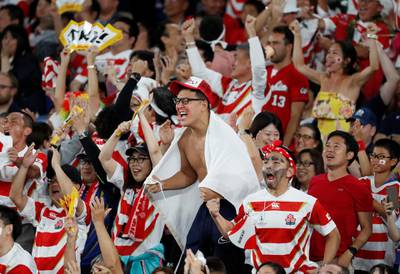 Japan fans celebrate their team's first try. Reuters