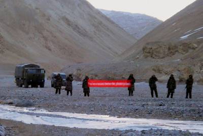 In this May 5, 2013 photo, Chinese troops hold a banner which reads: "You've crossed the border, please go back" in Ladakh, India. China on Tuesday, June 16, 2020 accused Indian forces along their Himalayan border of carrying out "provocative attacks" on its troops, leading to "serious physical conflicts" between the sides. AP Photo