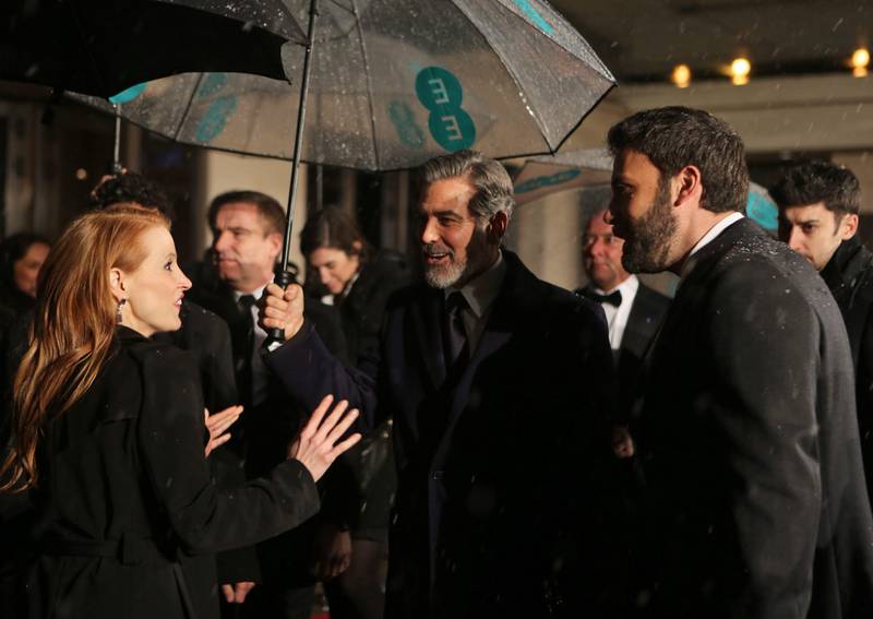 epa03578063 US actress Jessica Chastain (L) congratulates US producers George Clooney (C) and director Ben Affleck (L) after they won Best Film for 'Argo' during their arrival at the Official After Party for the British Academy Film Awards (BAFTA) at the Grosvenor House in London, Britain, 10 February 2013.  EPA/KAREL PRINSLOO *** Local Caption ***  03578063.jpg