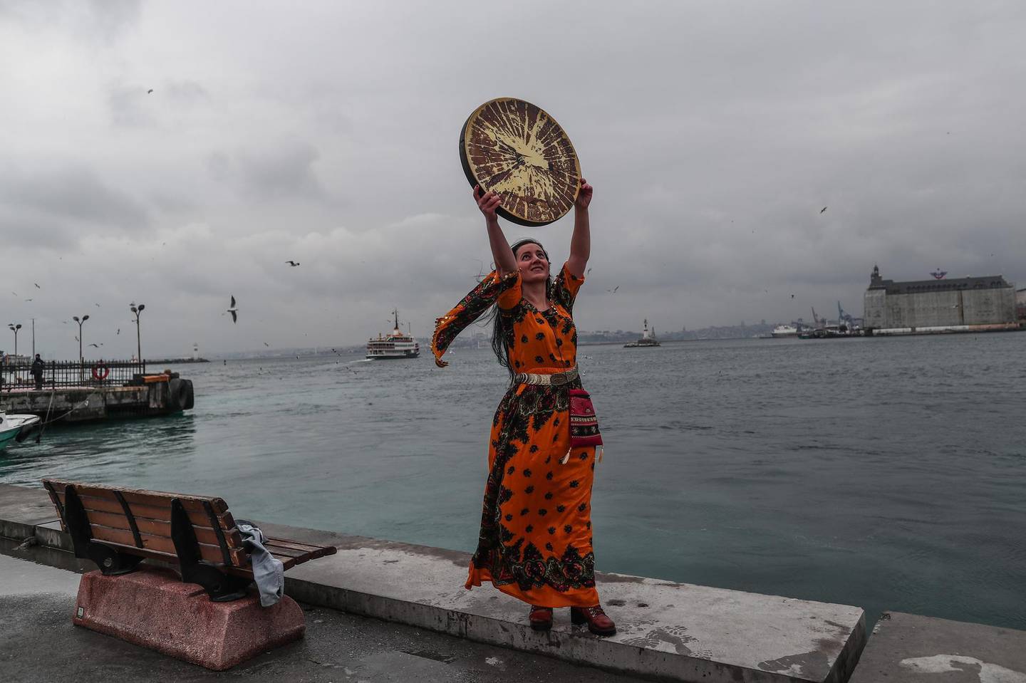 epa09057077 A Kurdish woman holds traditional instrument as she poses for her friend during a demonstration on the occasion of the International Day for the Elimination of Violence Against Women in Istanbul, Turkey, 06 March 2021. The International Day for the Elimination of Violence Against Women is an effort to raise awareness of the fact that women around the world are subject to rape, domestic violence and other forms of violence. According to the 'We'll Stop Femicide' social platform, 335 women were killed through gender violence and hundreds assaulted by men in 2020, in Turkey.  EPA/SEDAT SUNA