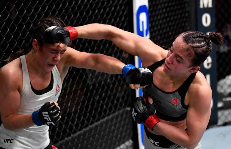 LAS VEGAS, NEVADA - FEBRUARY 13: (R-L) Maycee Barber punches Alexa Grasso of Mexico in their flyweight fight during the UFC 258 event at UFC APEX on February 13, 2021 in Las Vegas, Nevada. (Photo by Jeff Bottari/Zuffa LLC) *** Local Caption *** LAS VEGAS, NEVADA - FEBRUARY 13: (R-L) Maycee Barber punches Alexa Grasso of Mexico in their flyweight fight during the UFC 258 event at UFC APEX on February 13, 2021 in Las Vegas, Nevada. (Photo by Jeff Bottari/Zuffa LLC)