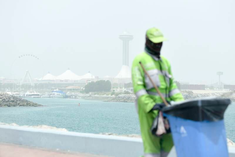 The Marina Mall area in Abu Dhabi is obscured by the dust. Khushnum Bhandari / The National
