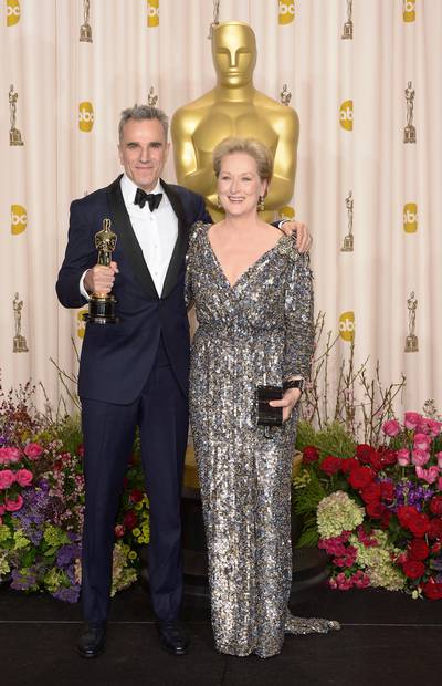 epa03599710 British actor Daniel Day-Lewis (L) holds his Oscar for Performance by an Actor in a Leading Role for 'Lincoln' as he stands with US actress and presenter Meryl Streep (R) at the 85th Academy Awards at the Dolby Theatre in Hollywood, California, USA, 24 February 2013. The Oscars are presented for outstanding individual or collective efforts in up to 24 categories in filmmaking.  EPA/PAUL BUCK