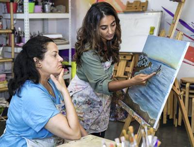 Abu Dhabi, United Arab Emirates, August 27, 2019.  Art Classes for Adults as a wellness trend at the Soul Art Center. --  (R-L)) Art teacher, Asareh Ebrahimpour with student, Haifa Salama.Victor Besa/The NationalSection:  ACReporter:  Alexandra Chaves