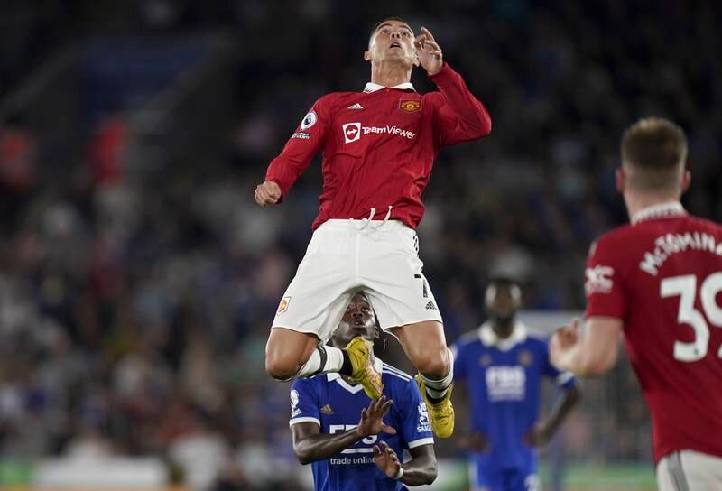 Substitute Cristiano Ronaldo leaps for the ball. EPA