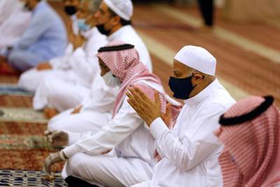 Worshippers wearing face masks to prevent the spread of Covid-19 pray at Al Mirabi Mosque in Jeddah, Saudi Arabia. AP Photo