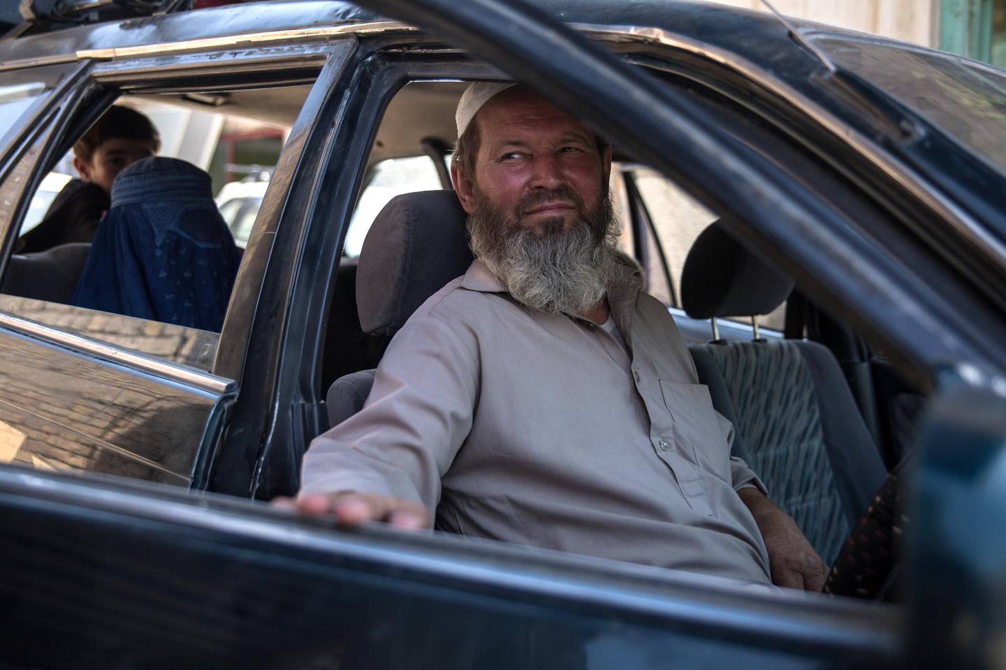 Haji Ahmad, 54, a former Soviet soldier, now works as a taxt driver in Kunduz city. He arrived in Afghanistan in 1984 and hasn't left since. 