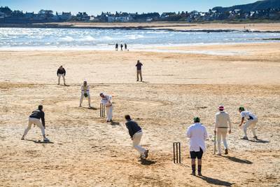 ELIE, SCOTLAND - MAY 12: Cricket players from the Ship Inn and Borderers teams hold the first match of the season at the beach on May 12, 2019 in Elie, Scotland. The Ship Inn pub is the only cricket team in the United Kingdom to play their matches on a beach. Over the course of a season they hold regular fixtures against Scottish clubs as well as touring teams from across the world. (Photo by Jeff J Mitchell/Getty Images)