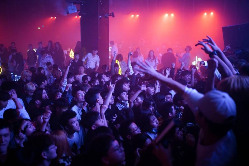 People dance at a nightclub, almost a year after the global outbreak of the coronavirus disease in Wuhan, Hubei province, China, on December 12, 2020. Reuters