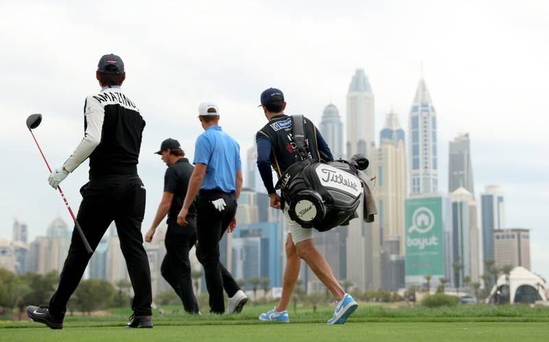 Min Woo Lee of Australia, Thomas Pieters of Belgium and Victor Perez of France walk from the 8th tee. Getty Images