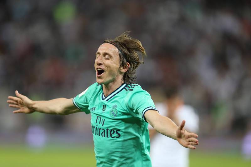 Luka Modric celebrates scoring the third.  EPA
