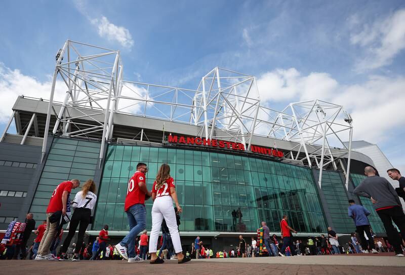 Manchester United fans arrive at Old Trafford prior to the opening match of the season against Brighton and Hove Albion on Sunday, August 07, 2022. Getty