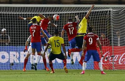 Arturo Vidal of Chile heads the ball to score against Colombia for a 1-0 lead on Thursday night in their 2018 World Cup qualifying match. Ivan Alvarado / Reuters