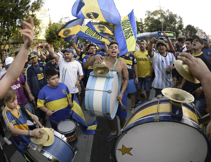 A band plays as supporters of Boca Juniors gather at Lezama park to cheer for their team before their trip to Madrid. AFP