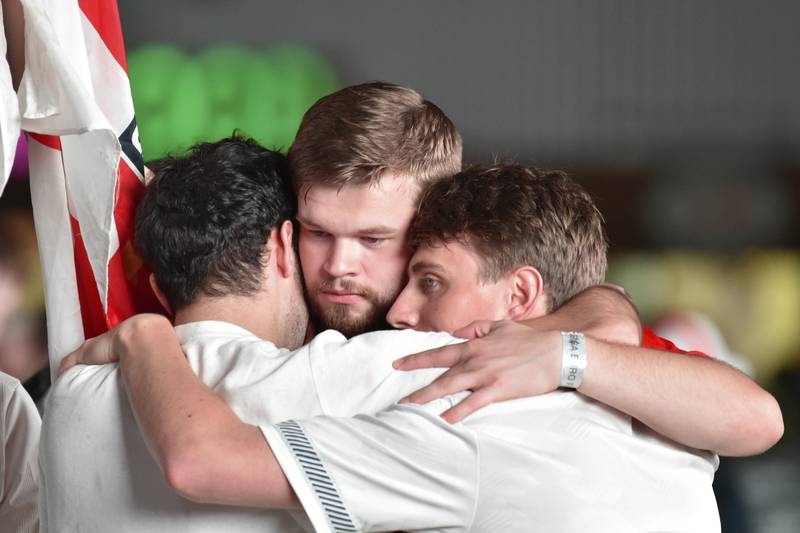 English supporters comfort each other at a fan zone in Manchester after the Euro 2020 loss.