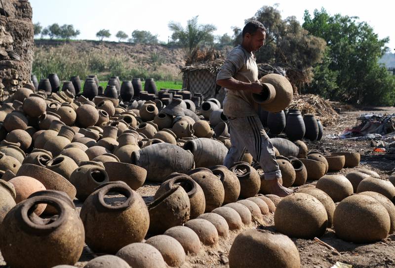 An Egyptian potter at El Nazla village in Fayoum, south-west of Cairo. All photos: Reuters