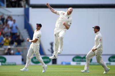 Ben Stokes of England celebrates with James Anderson and Joe Root after dismissing Mohammed Shami. Getty Images