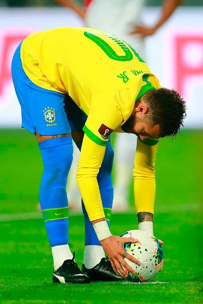Brazil's Neymar takes a penalty. AFP