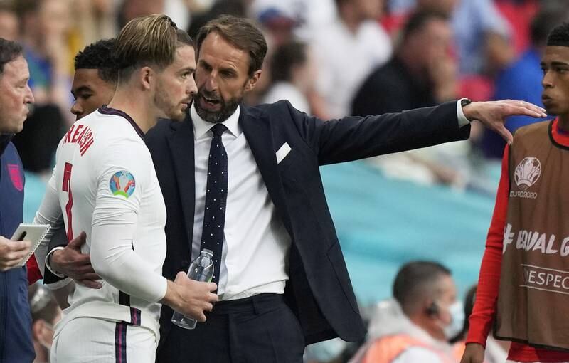 England manager Gareth Southgate gives instructions to Jack Grealish. EPA