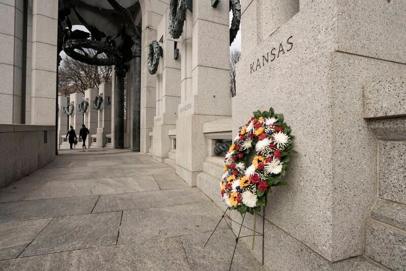 A wreath is set at the base of the Kansas monument at the World War II Monument. EPA