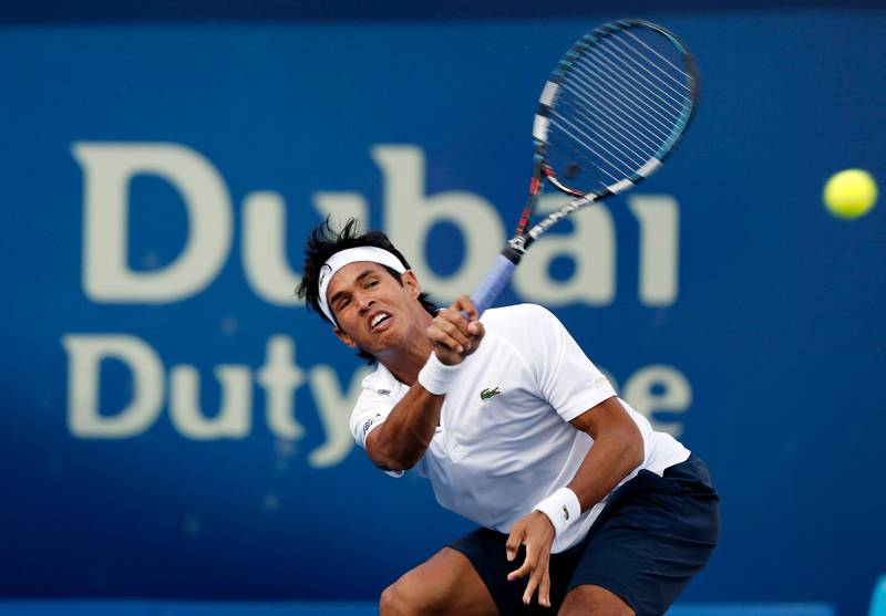 Somdev Devvarman of India hits a return to Juan Martin Del Potro of Argentina during their men's singles match at the ATP Dubai Tennis Championships, February 27, 2013. REUTERS/Mohammed Salem (UNITED ARAB EMIRATES - Tags: SPORT TENNIS) *** Local Caption ***  DUB12_TENNIS-MEN-DU_0227_11.JPG