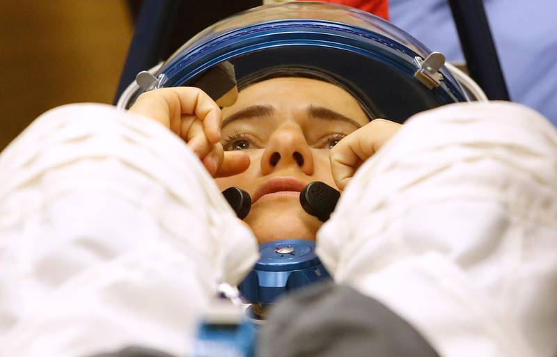 US astronaut Jessica Meir has her space suit inspected ahead of the launch. Dmitri Lovetsky / AP