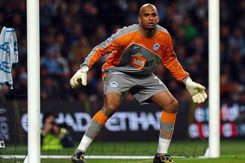 Wigan Athletic's Omani goalkeeper Ali Al Habsi in action during the English Premier League football match between Manchester City and Wigan Athletic at The City of Manchester Stadium, Manchester, north-west England on March 5, 2011. AFP PHOTO/PAUL ELLISFOR EDITORIAL USE ONLY Additional licence required for any commercial/promotional use or use on TV or internet (except identical online version of newspaper) of Premier League/Football League photos. Tel DataCo +44 207 2981656. Do not alter/modify photo.