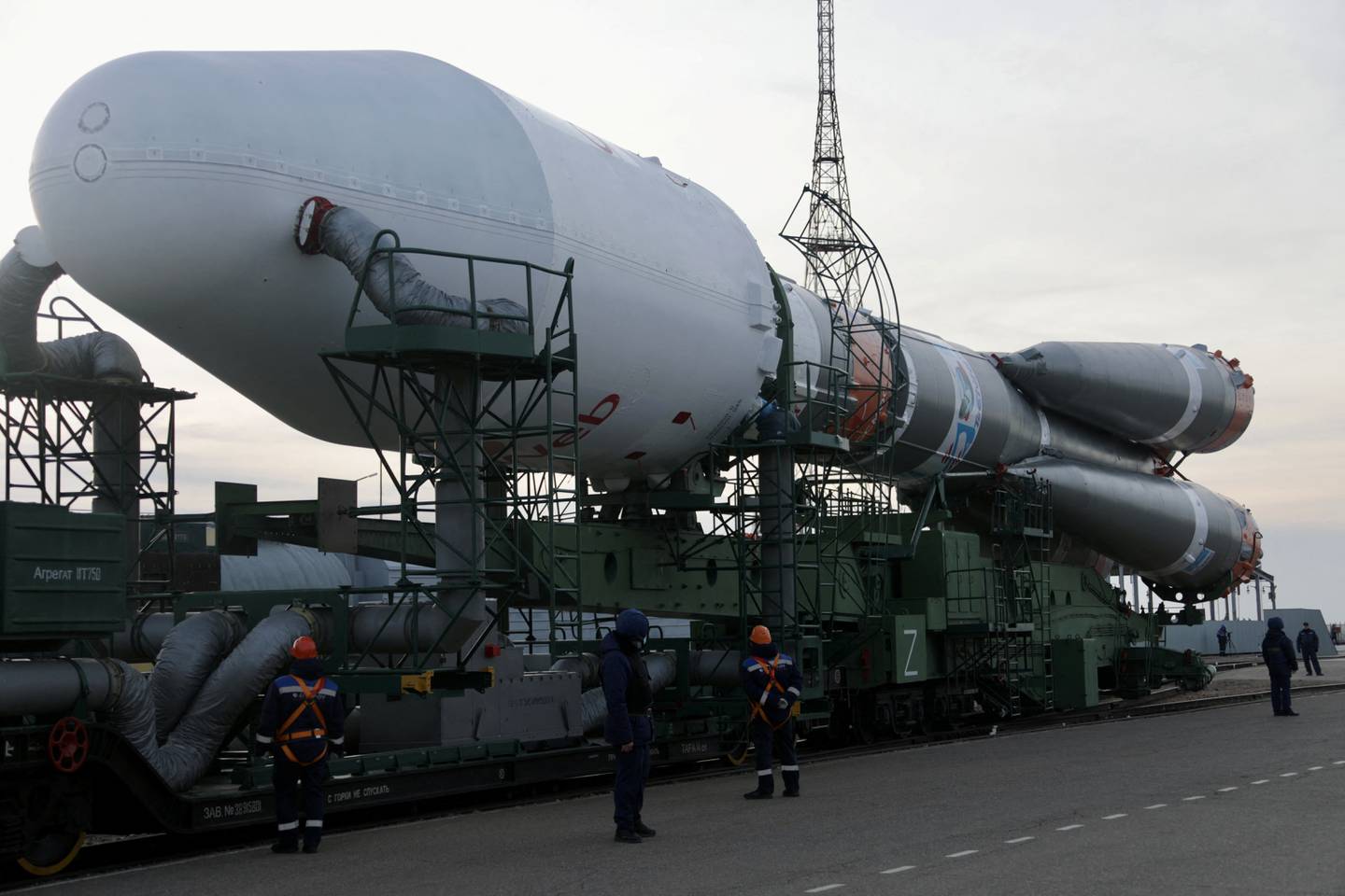 A Soyuz-2.1b rocket booster with a Fregat upper stage and satellites of British firm OneWeb is removed from a launchpad in Kazakhstan. Reuters 