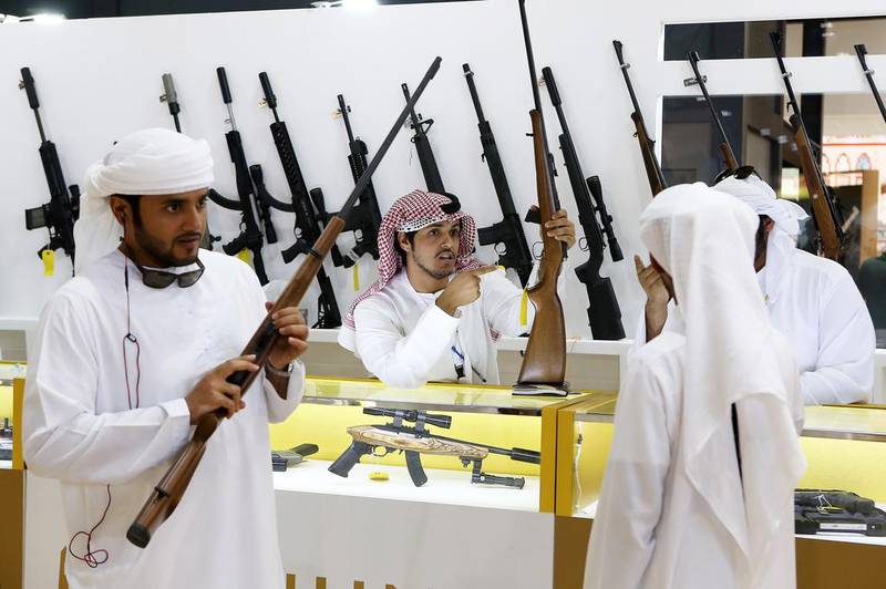 Visitors check out the rifles at the BRNO Rifles stand at Adihex.