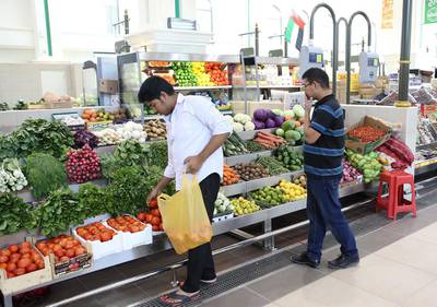 Shoppers in the fruit section of Souq Al Jubeil in Sharjah. The new home for the market, developed at a cost of Dh195m, has met with a warm welcome from shoppers and traders and will officially open for business on Friday. Pawan Singh / The National