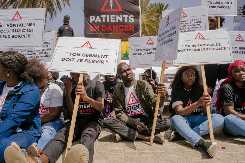 People demonstrate in Senegal's capital Dakar over the death of a pregnant woman in April. The death of 11 babies on Wednesday has brought the country's public health centres under further scrutiny. AFP