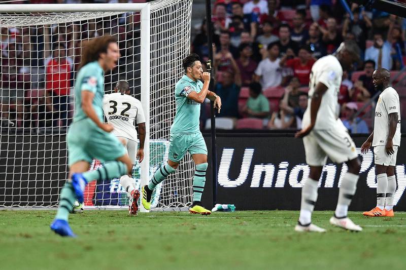 SINGAPORE - JULY 28: Mesut Ozil #10 of Arsenal celebrates his goal during the International Champions Cup match between Arsenal and Paris Saint Germain at the National Stadium on July 28, 2018 in Singapore.  (Photo by Thananuwat Srirasant/Getty Images  for ICC)