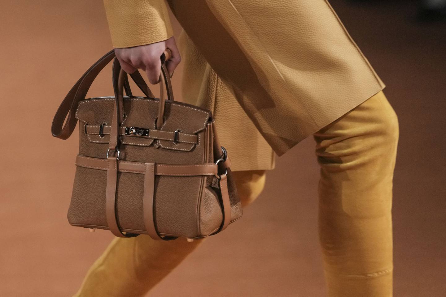 Hermes Fall/Winter 2023 has updated the iconic Birkin bag with new straps.  AP