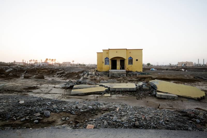 A damaged property stands alone amid the destruction in Qasbit Al Zaab.