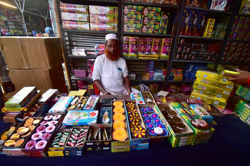 A vendor selling firecrackers in Allahabad. AFP