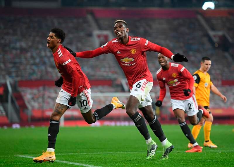 Marcus Rashford celebrates with Paul Pogba during the 2020-21 campaign, when United were runners-up with 74 points. EPA