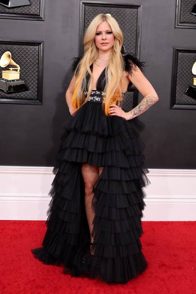 Avril Lavigne, wearing a layered black dress. AFP