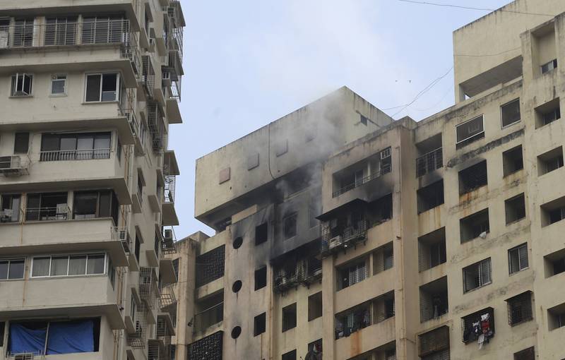 Smoke rises from a building that caught fire in Mumbai, India, on Saturday.  AP Photo