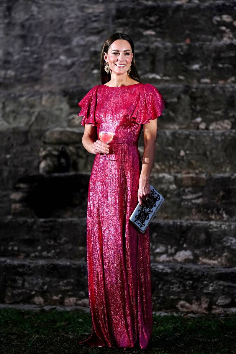Catherine in a metallic pink The Vampire's Wife dress to attend a reception in celebration of the queen's platinum jubilee at the Mayan ruins in Cahal Pech, Belize on March 21. Reuters