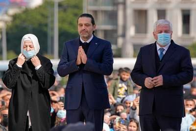 Former Lebanon prime minister Saad Hariri commemorates the 17th anniversary of his father Rafik's assassination by praying at his grave along with his aunt Bahia Hariri, left, and his uncle Chafik Hariri, in Beirut.  Photo: AP