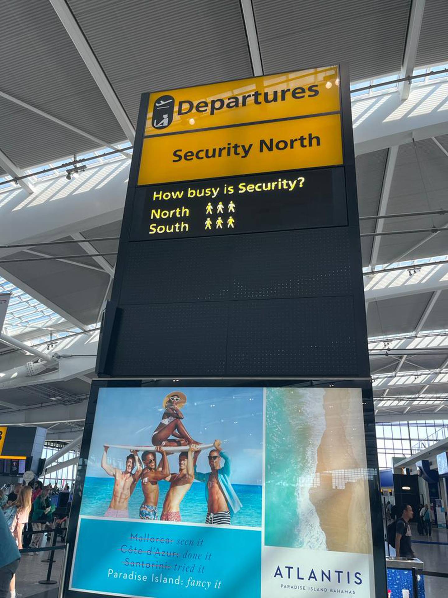 A digital board displays how busy security is at Heathrow. Paul Carey / The National