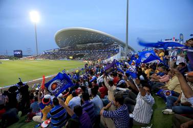 Mumbai Indians fans cheer they team on the opening match between Mumbai Indians and Kolkata Knight Riders in IPL 2014 at Zayed Cricket Stadium in Abu Dhabi. Ravindranath K / The National