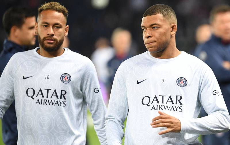 Paris Saint-Germain's Neymar and Kylian Mbappe warm up before kick off. AFP
