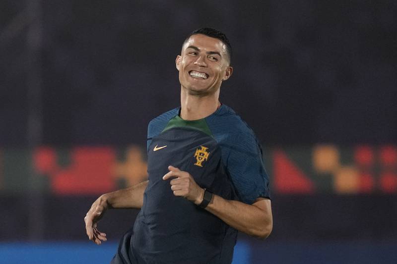 Portugal's Cristiano Ronaldo warms up during the Portugal's official training on the eve of the group H World Cup soccer match between Portugal and Ghana at the Al Shahaniya SC training site in Al Shahaniya, Qatar, Wednesday, Nov.  23, 2022.  (AP Photo / Lee Jin-man)
