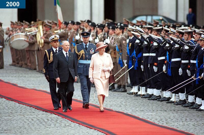 2000: The queen and Italy's president Carlo Azeglio Ciampi walk  past the honour guard at the Piazza Di Siena in Rome.