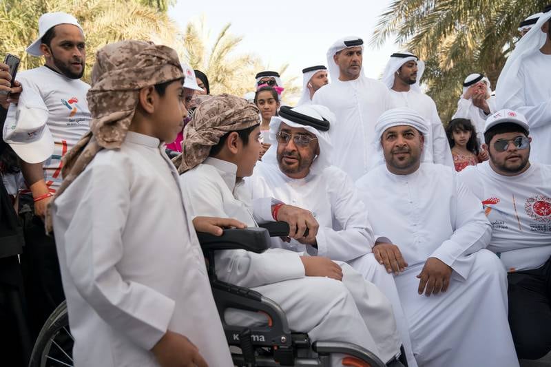 ABU DHABI, UNITED ARAB EMIRATES - January 26, 2018: HH Sheikh Mohamed bin Zayed Al Nahyan, Crown Prince of Abu Dhabi and Deputy Supreme Commander of the UAE Armed Forces (3rd L) speaks with a participant during the in Special Olympics Wold Games Abu Dhabi 2019 initiative "Walk Unified", at Umm Al Emarat Park.
( Mohamed Al Hammadi / Crown Prince Court - Abu Dhabi )
---