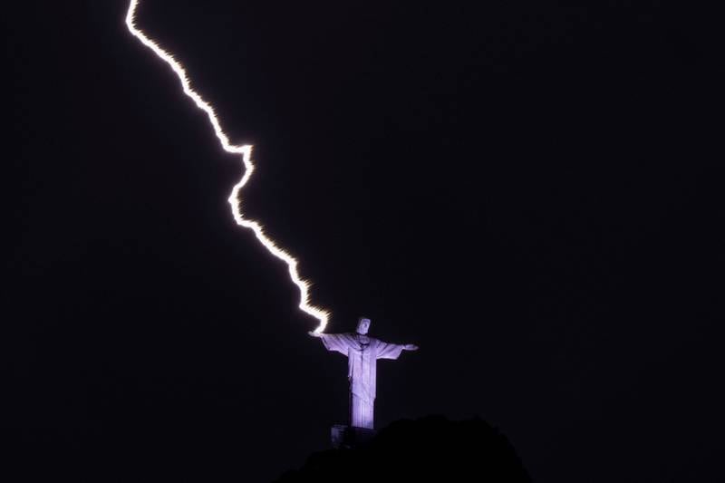 Lightning hits the hand of the Christ the Redeemer statue in Rio de Janeiro, Brazil. AFP