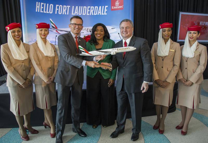 Hubert Frach, Emirates' divisional senior vice president of commercial operations for the western hemisphere, Barbara Sharief, Broward county mayor, and Mark Gale, Fort Lauderdale-Hollywood international airport chief, during the ceremonial gift exchange. Fla Jesus Aranguren / AP Images for Emirates